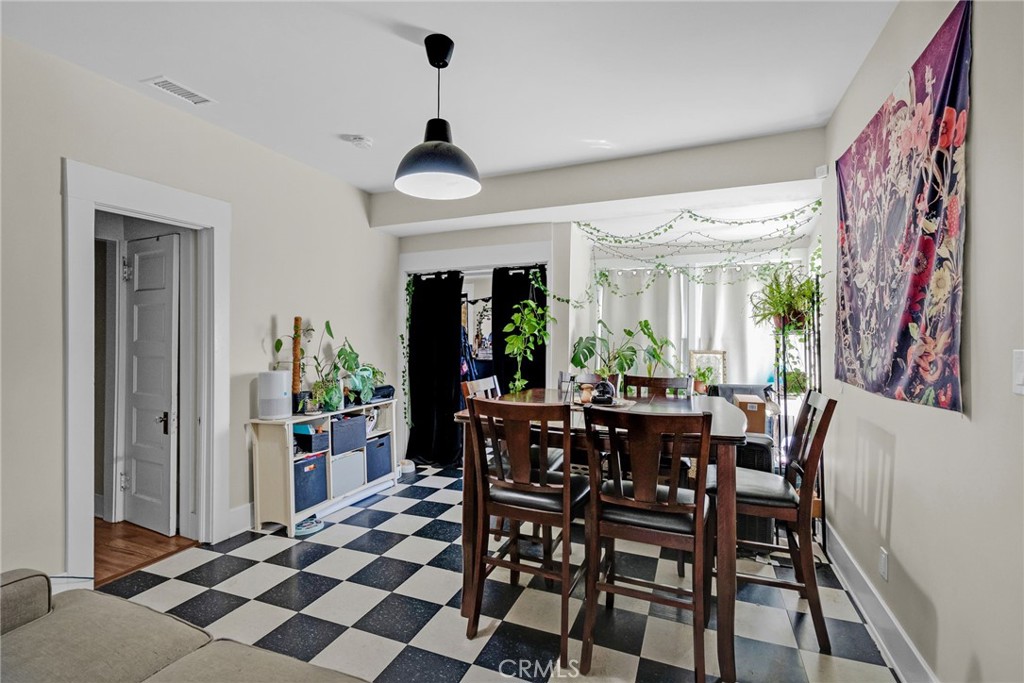 3744 Stoddard Avenue Riverside, CA 92501 - Photo 15 of 29 a view of a dining room with furniture and chandelier