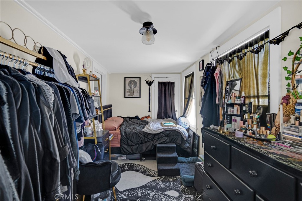 3744 Stoddard Avenue Riverside, CA 92501 - Photo 21 of 29 a view of walk in closet with clothes and shoes