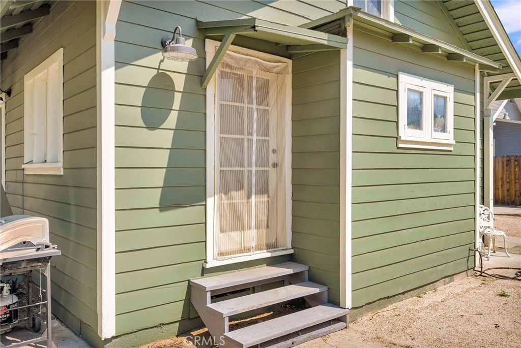 3744 Stoddard Avenue Riverside, CA 92501 - Photo 22 of 29 a view of wooden door and a wooden bench