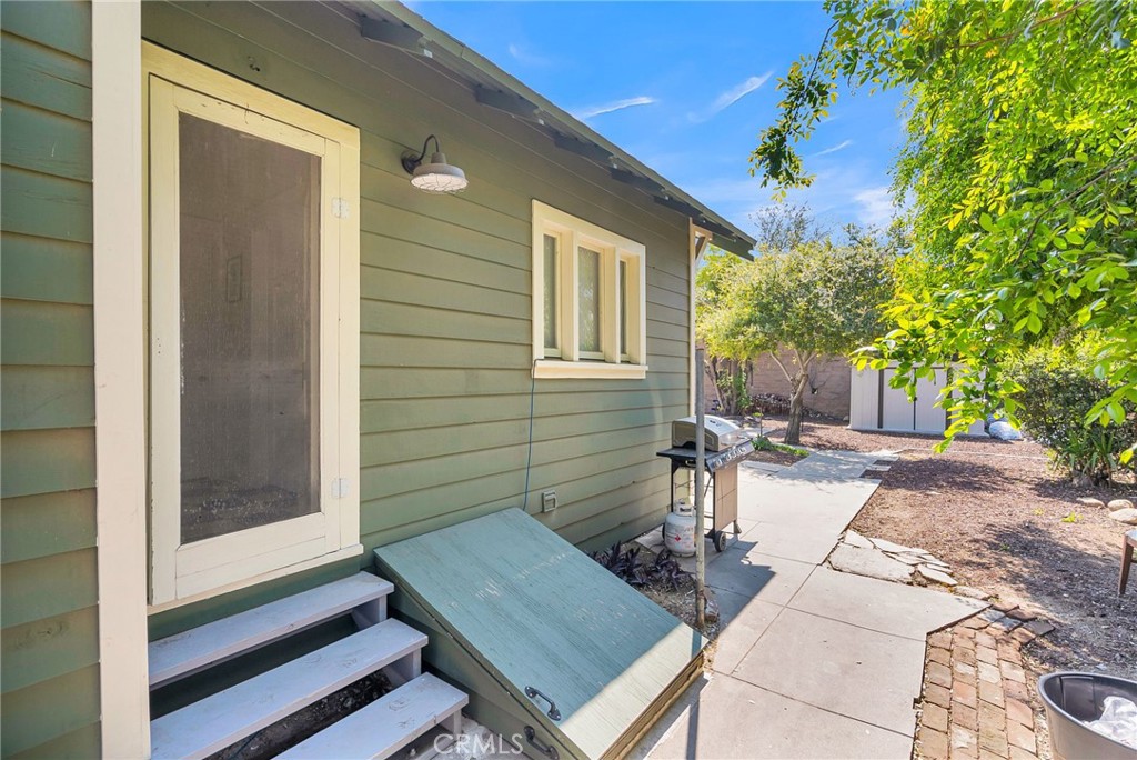 3744 Stoddard Avenue Riverside, CA 92501 - Photo 23 of 29 a view of a patio with a table and chairs and potted plants