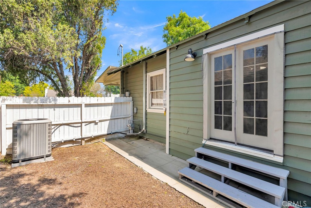 3744 Stoddard Avenue Riverside, CA 92501 - Photo 24 of 29 a view of a house with a large window and wooden fence