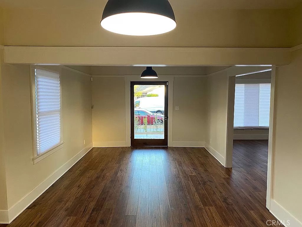 3744 Stoddard Avenue Riverside, CA 92501 - Photo 29 of 29 an empty room with wooden floor and windows