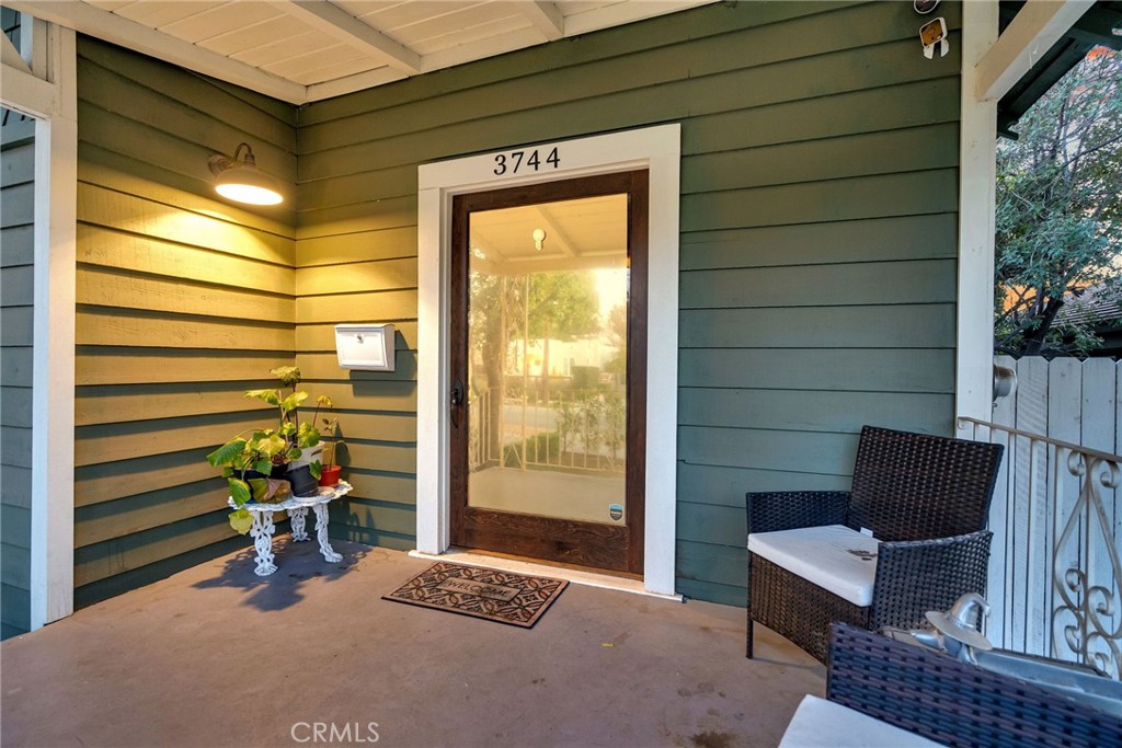 3744 Stoddard Avenue Riverside, CA 92501 - Photo 5 of 29 a view of a patio with a table and chairs and potted plants