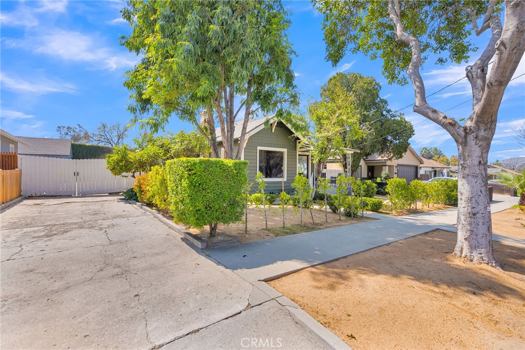 3744 Stoddard Avenue Riverside, CA 92501 - Photo 7 of 29 a front view of a house with a yard and a garage