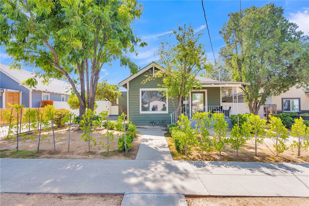 3744 Stoddard Avenue Riverside, CA 92501 - Photo 8 of 29 a front view of a house with garden