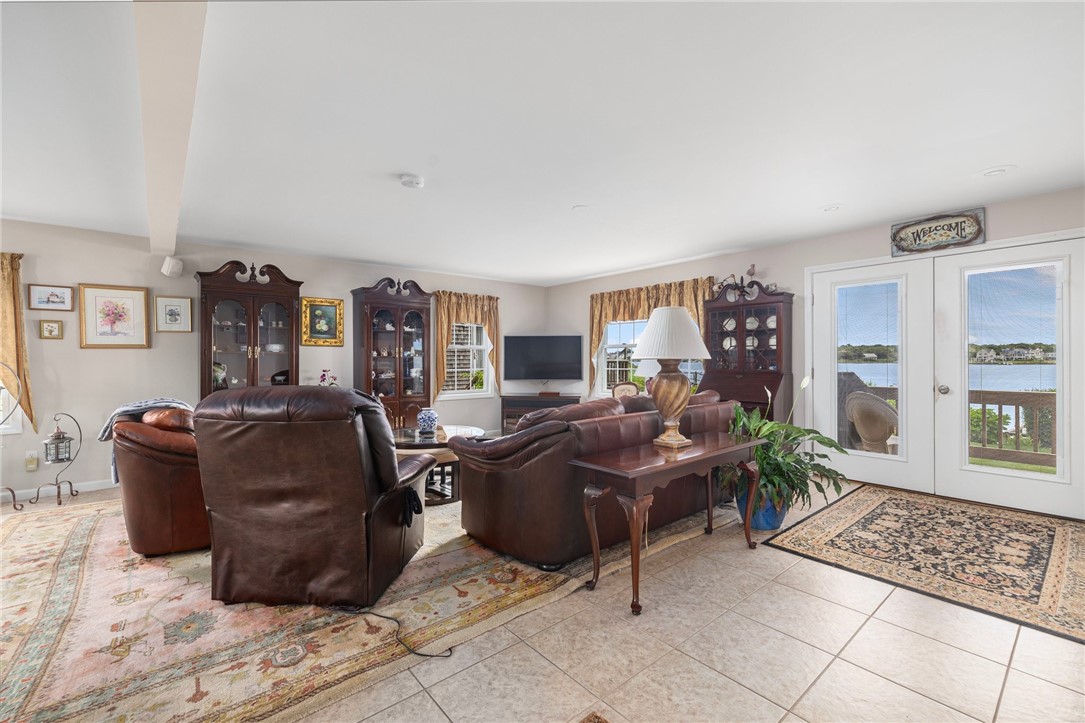 69 East Shore Road Narragansett, RI 02882 - Photo 12 of 42 Generous open living room with gorgeous views of the salt pond
