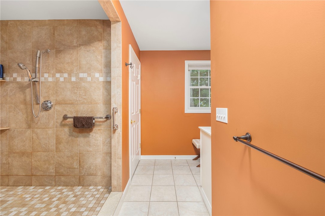 69 East Shore Road Narragansett, RI 02882 - Photo 21 of 42 Master bath includes a HUGE walk in shower. Behind the white door in the photo is a private toilet area.