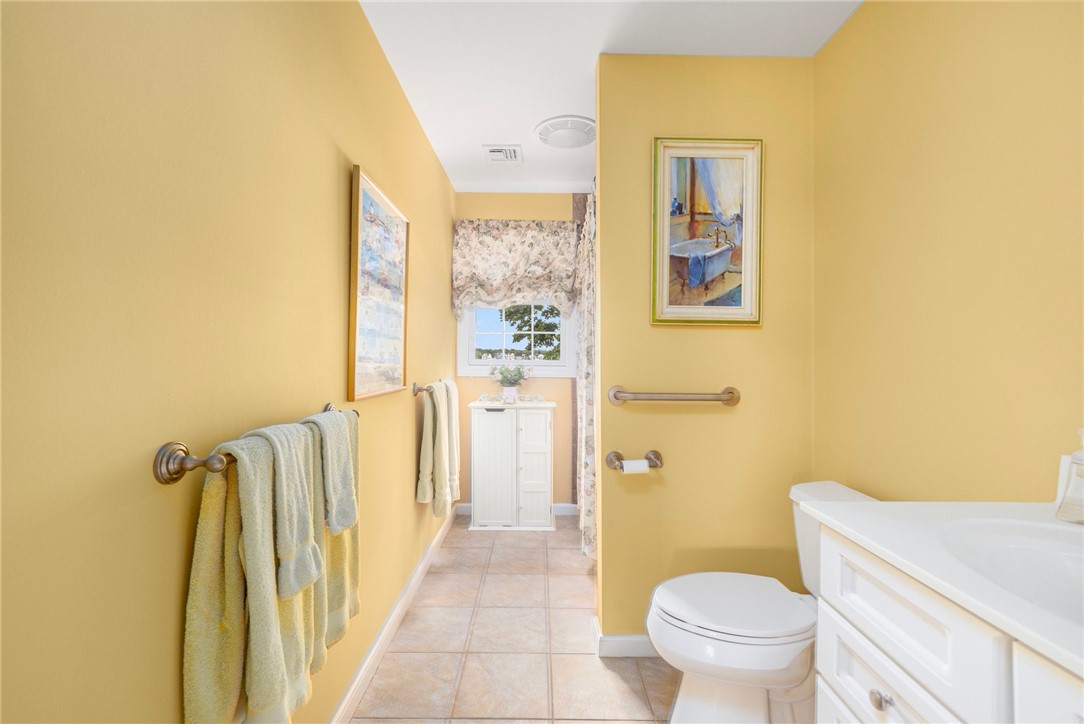 69 East Shore Road Narragansett, RI 02882 - Photo 29 of 42 Sunny full bath (tub/shower) serves the two bedrooms off the family room