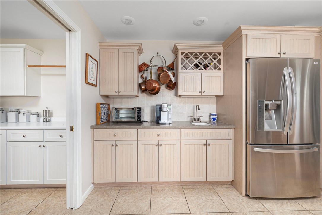 69 East Shore Road Narragansett, RI 02882 - Photo 7 of 42 View from kitchen to pantry; a pocket door allows you to close the area off when not in use.
