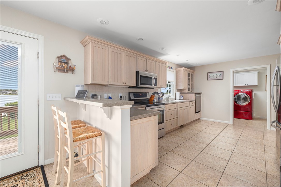 69 East Shore Road Narragansett, RI 02882 - Photo 8 of 42 Spacious kitchen equipped with handy breakfast bar.