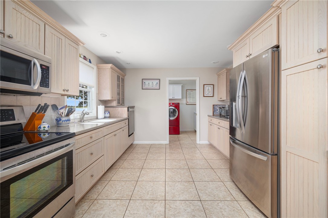 69 East Shore Road Narragansett, RI 02882 - Photo 10 of 42 Oversized kitchen has plenty of space for loads of kitchen helpers with handy raised dishwasher