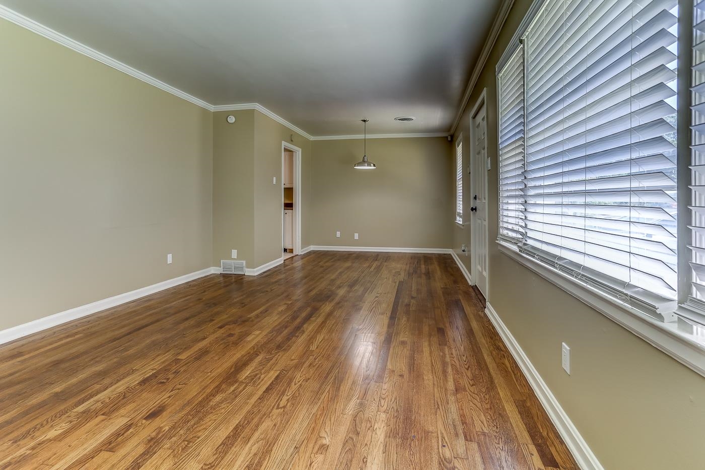 1787 Dearing Road Memphis, TN 38117 - Photo 3 of 26 Spare room with wood-type flooring and ornamental molding