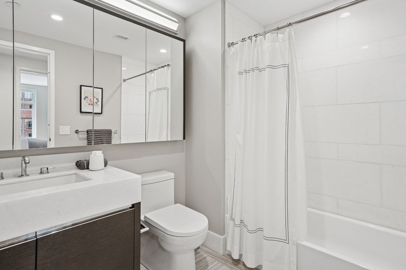 100 Lovejoy Wharf, Unit 5N Boston, MA 02114 - Photo 11 of 23 a bathroom with a sink toilet and shower
