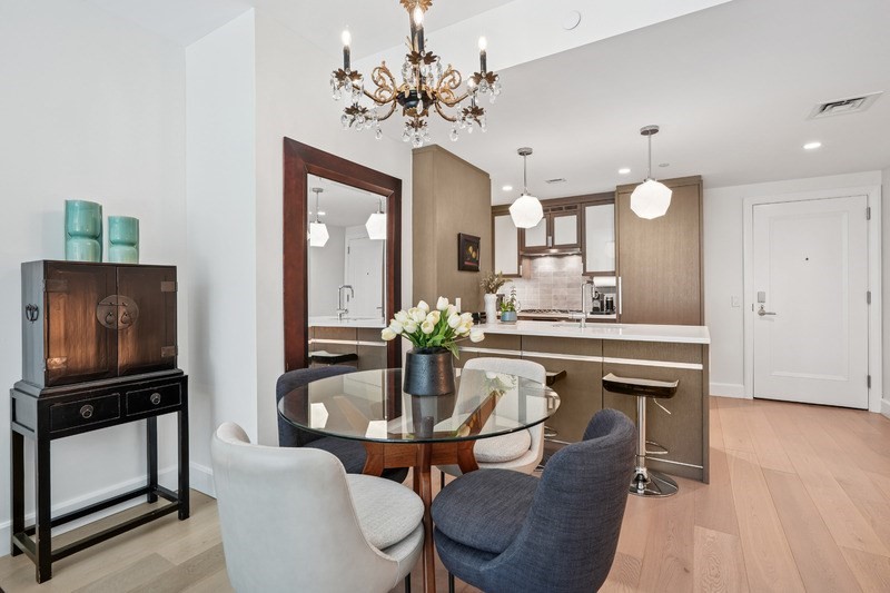 100 Lovejoy Wharf, Unit 5N Boston, MA 02114 - Photo 4 of 23 a dining room with furniture and window