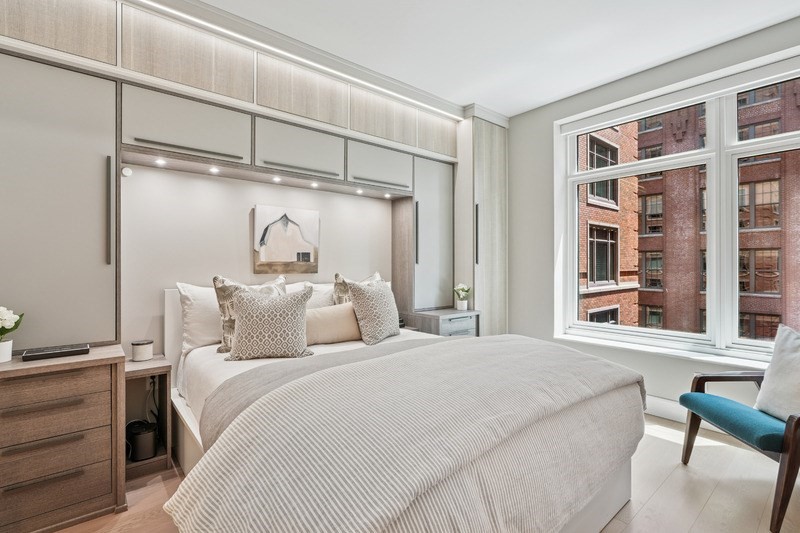 100 Lovejoy Wharf, Unit 5N Boston, MA 02114 - Photo 7 of 23 a bedroom with a large bed and a window