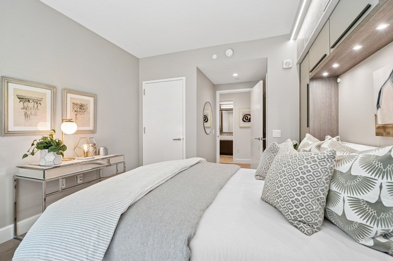 100 Lovejoy Wharf, Unit 5N Boston, MA 02114 - Photo 9 of 23 a bedroom with a bed and a couch