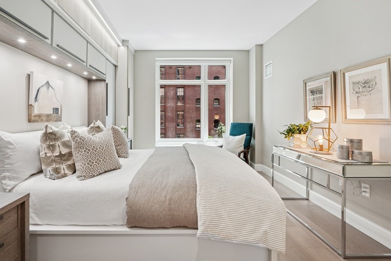 100 Lovejoy Wharf, Unit 5N Boston, MA 02114 - Photo 10 of 23 a bedroom with a large bed and a large window