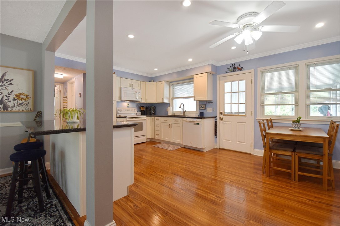 1388 Ford Road Lyndhurst, OH 44124 - Photo 5 of 39 Kitchen with a healthy amount of sunlight, white appliances, light wood-type flooring, and ceiling fan
