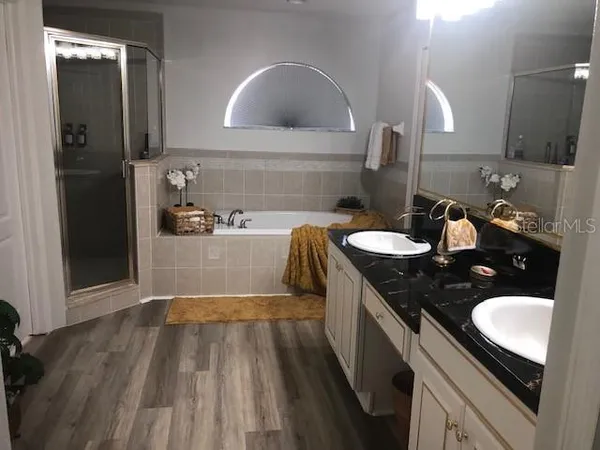 a kitchen with a sink and refrigerator