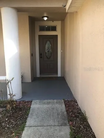 a view of a door and a window