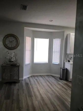 a room with a fireplace and a window