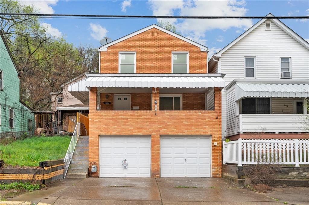 806 Ridge Avenue McKees Rocks, PA 15136 - Photo 1 of 30 a front view of a house with a garage