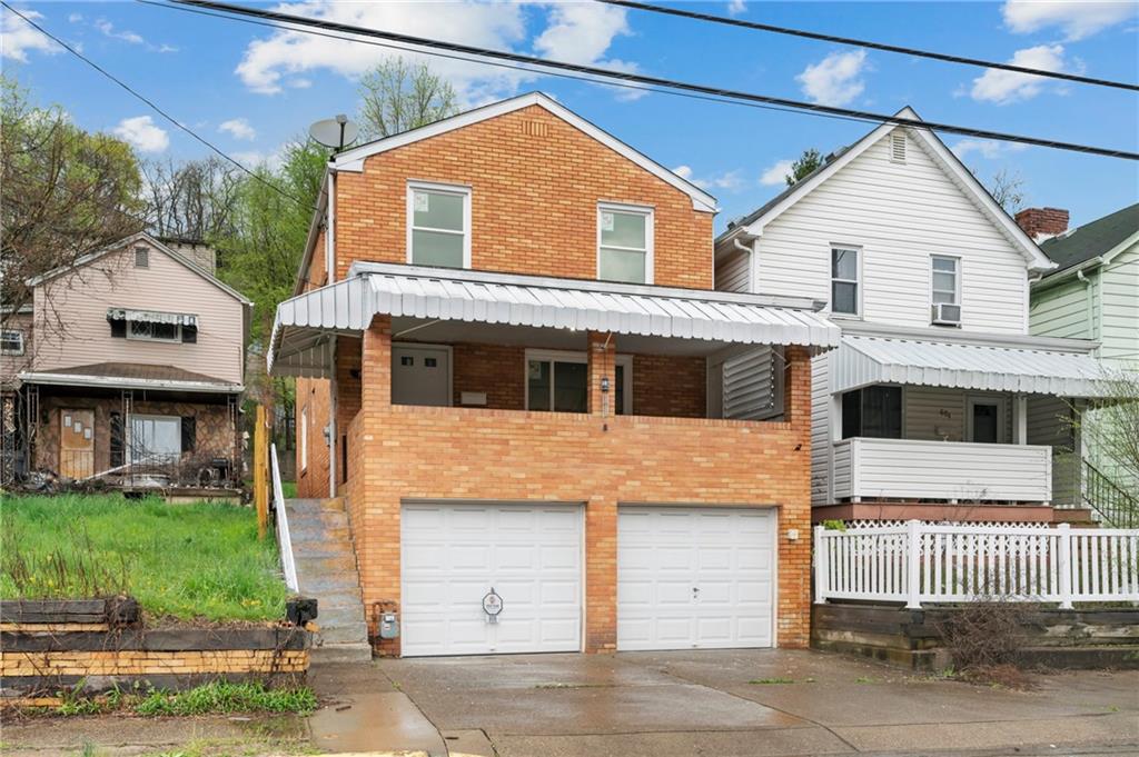806 Ridge Avenue McKees Rocks, PA 15136 - Photo 2 of 30 a front view of a house with a yard
