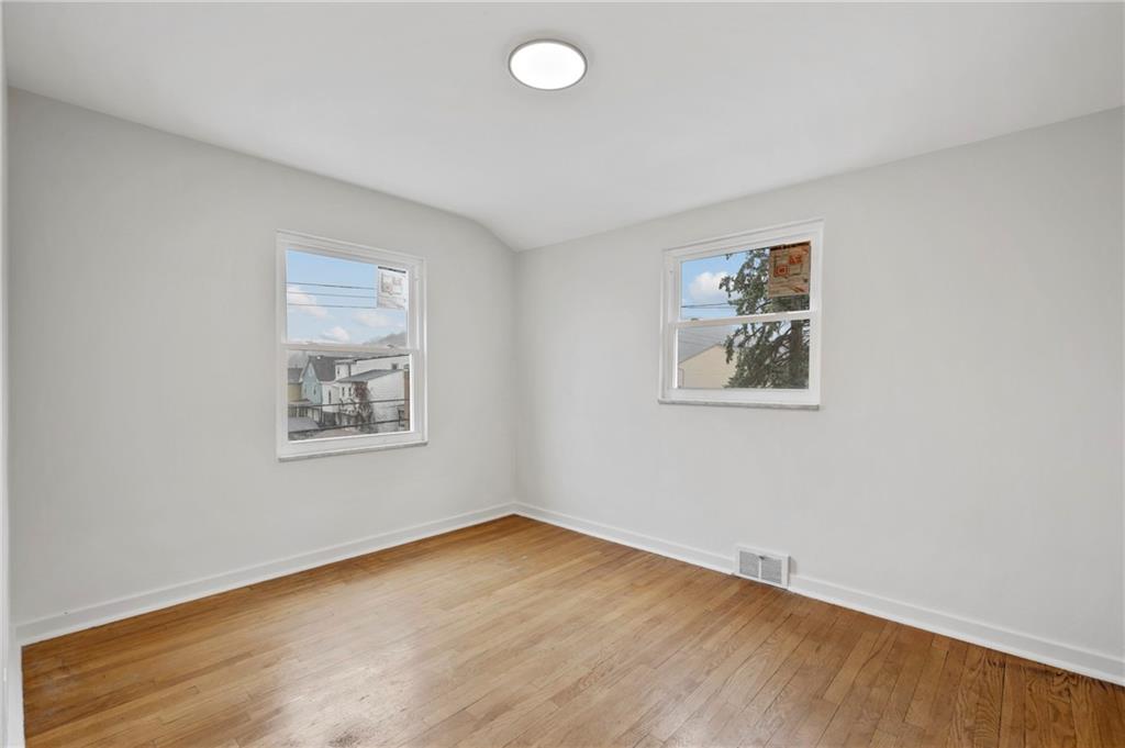806 Ridge Avenue McKees Rocks, PA 15136 - Photo 26 of 30 wooden floor in an empty room with a window
