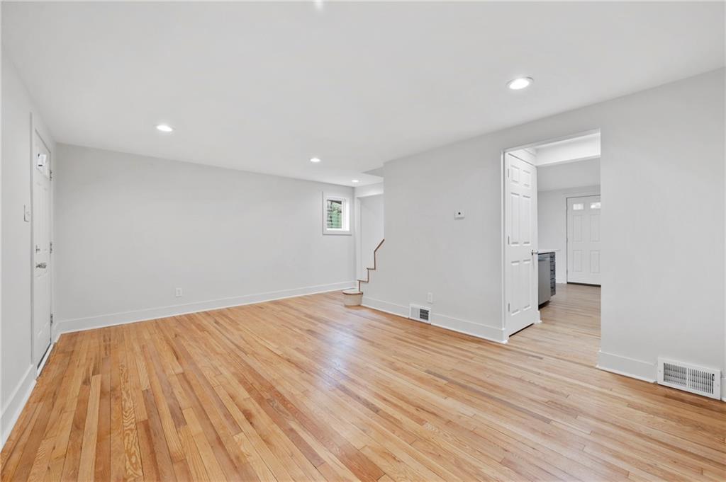 806 Ridge Avenue McKees Rocks, PA 15136 - Photo 9 of 30 wooden floor in an empty room with a window