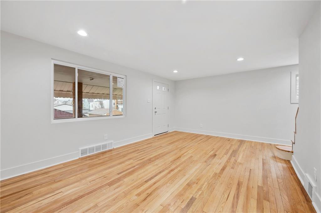 806 Ridge Avenue McKees Rocks, PA 15136 - Photo 10 of 30 a view of empty room with wooden floor and fan