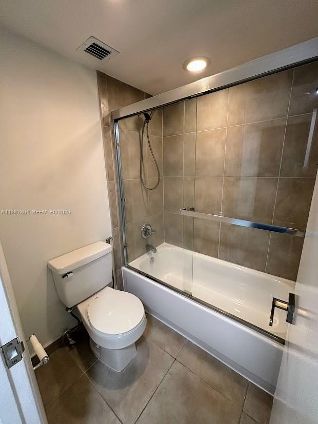 680 Northeast 64th Street, Unit A516 Miami, FL 33138 - Photo 13 of 54 a bathroom with a toilet and a bath tub