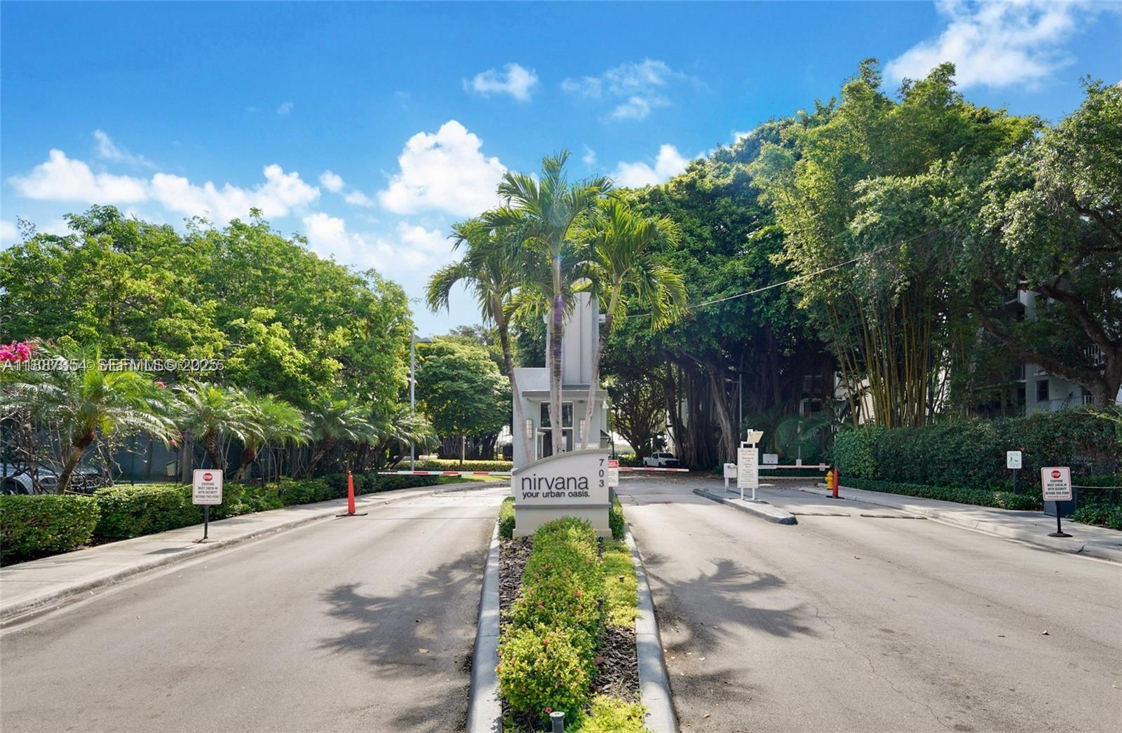 680 Northeast 64th Street, Unit A516 Miami, FL 33138 - Photo 17 of 54 a pathway of a house with a yard