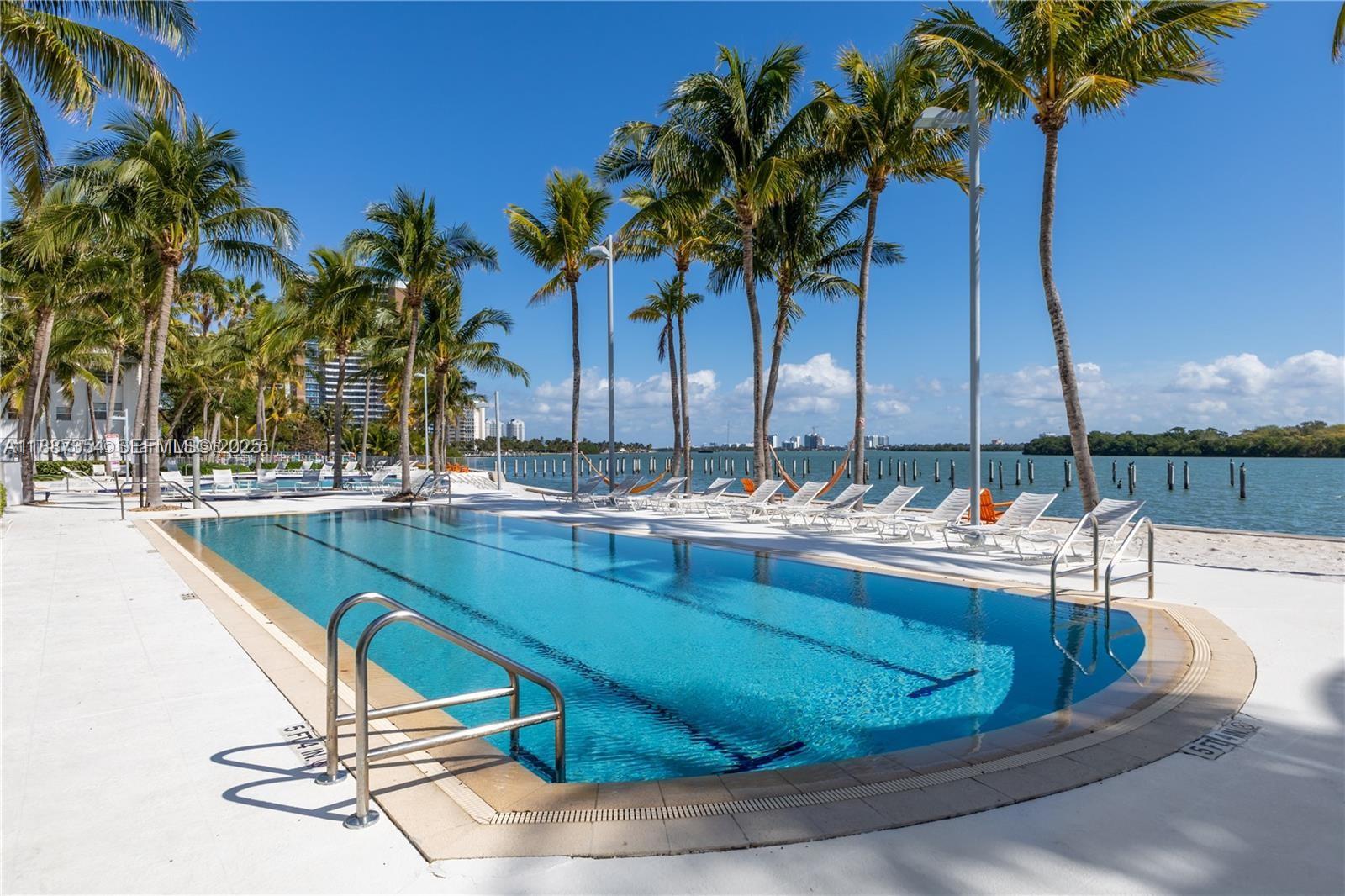 680 Northeast 64th Street, Unit A516 Miami, FL 33138 - Photo 26 of 54 a view of swimming pool with chairs