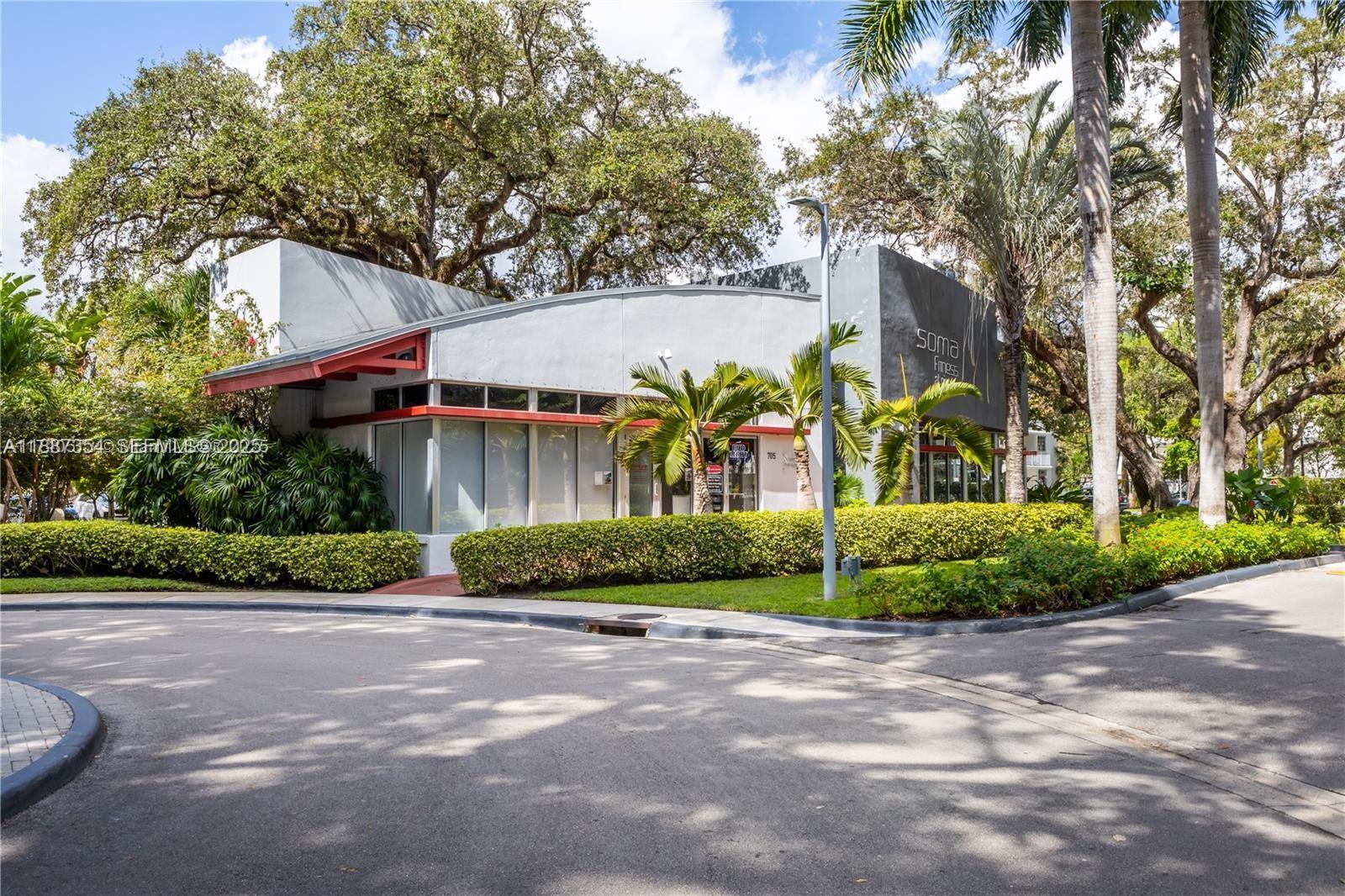 680 Northeast 64th Street, Unit A516 Miami, FL 33138 - Photo 29 of 54 a front view of a house with garden