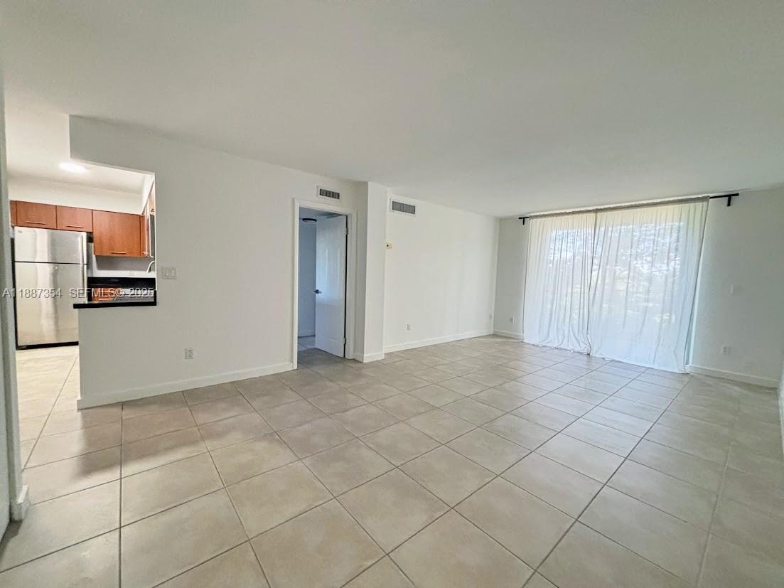 680 Northeast 64th Street, Unit A516 Miami, FL 33138 - Photo 3 of 54 a view of an empty room with a sink