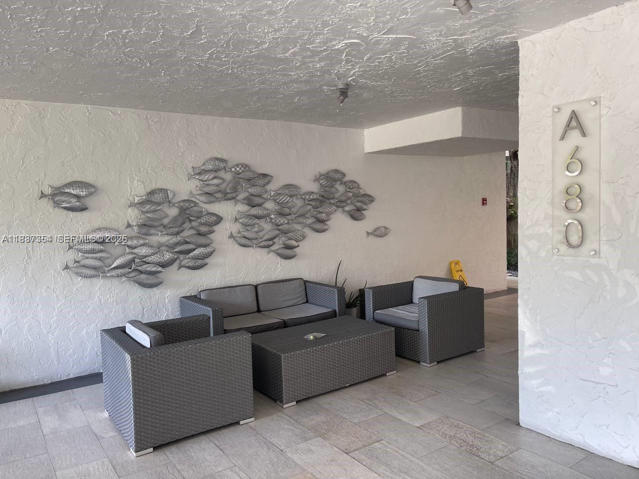 680 Northeast 64th Street, Unit A516 Miami, FL 33138 - Photo 41 of 54 a living room with furniture