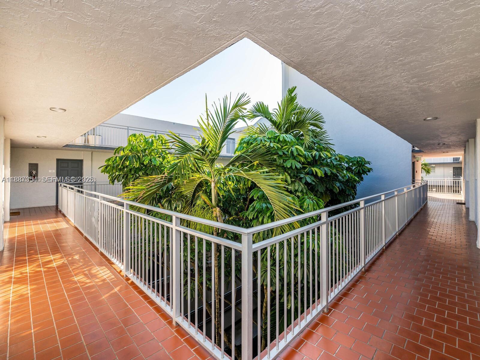 680 Northeast 64th Street, Unit A516 Miami, FL 33138 - Photo 42 of 54 a view of a potted plants with wooden floor