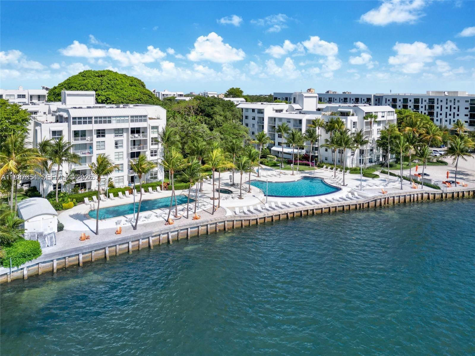 680 Northeast 64th Street, Unit A516 Miami, FL 33138 - Photo 45 of 54 a view of a lake with a city