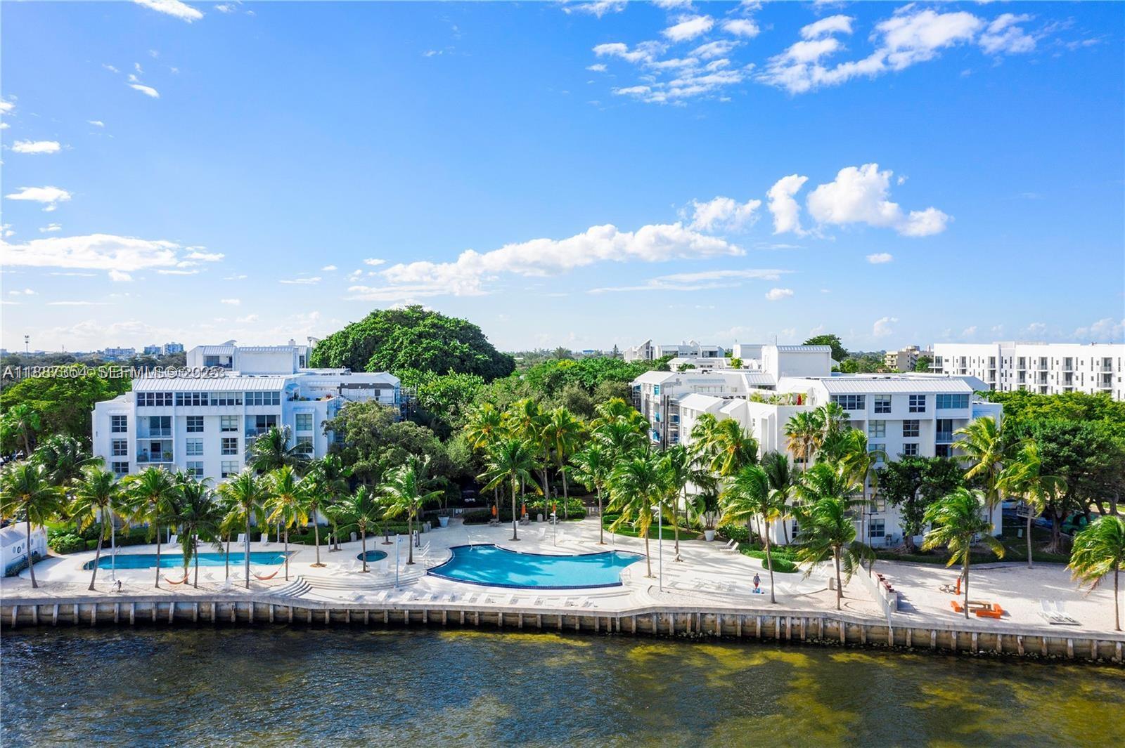 680 Northeast 64th Street, Unit A516 Miami, FL 33138 - Photo 54 of 54 a view of a lake with a house