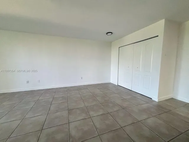 a view of an empty room and entryway