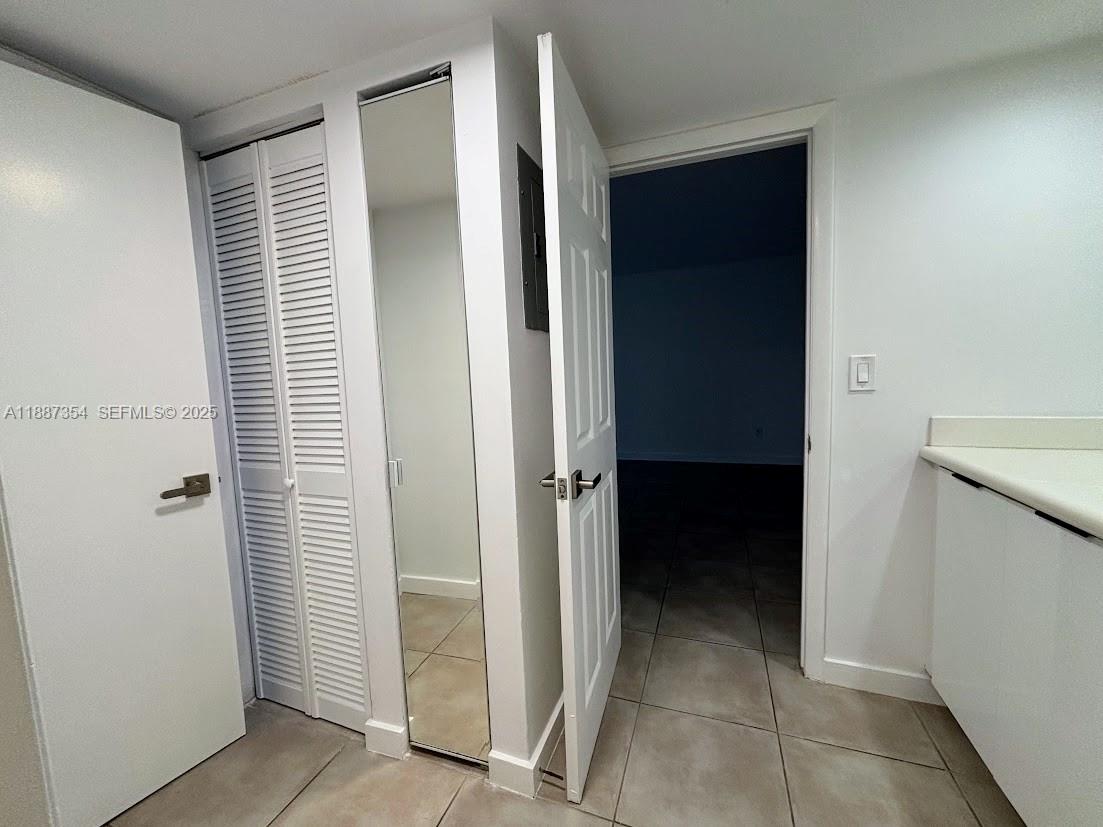 680 Northeast 64th Street, Unit A516 Miami, FL 33138 - Photo 8 of 54 a view of closet area with window