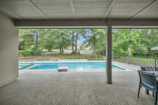 a view of swimming pool with a porch