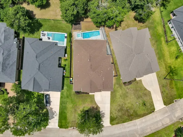an aerial view of residential house with outdoor space