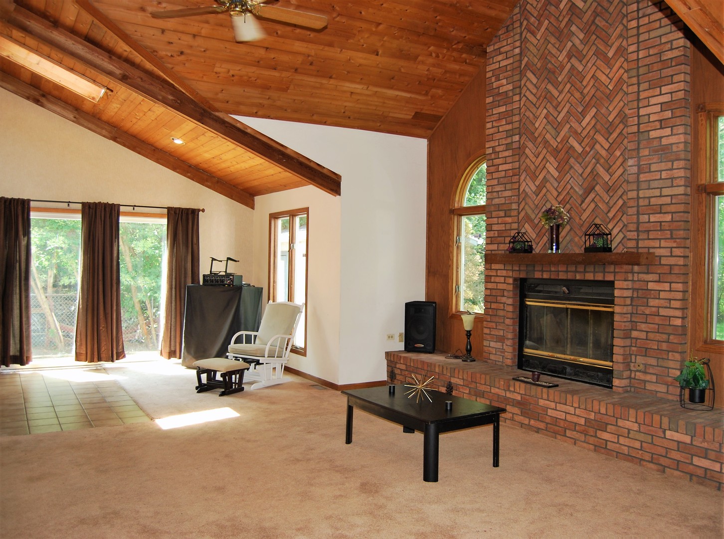 604 Golfview Terrace Buffalo Grove, IL 60089 - Photo 5 of 24 a living room with furniture a fireplace and a table