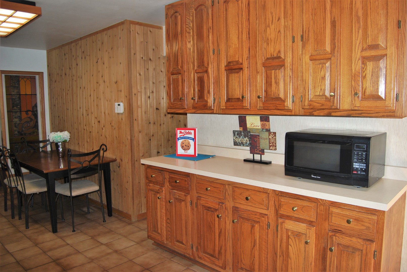 604 Golfview Terrace Buffalo Grove, IL 60089 - Photo 8 of 24 a kitchen with stainless steel appliances a stove a sink and a microwave