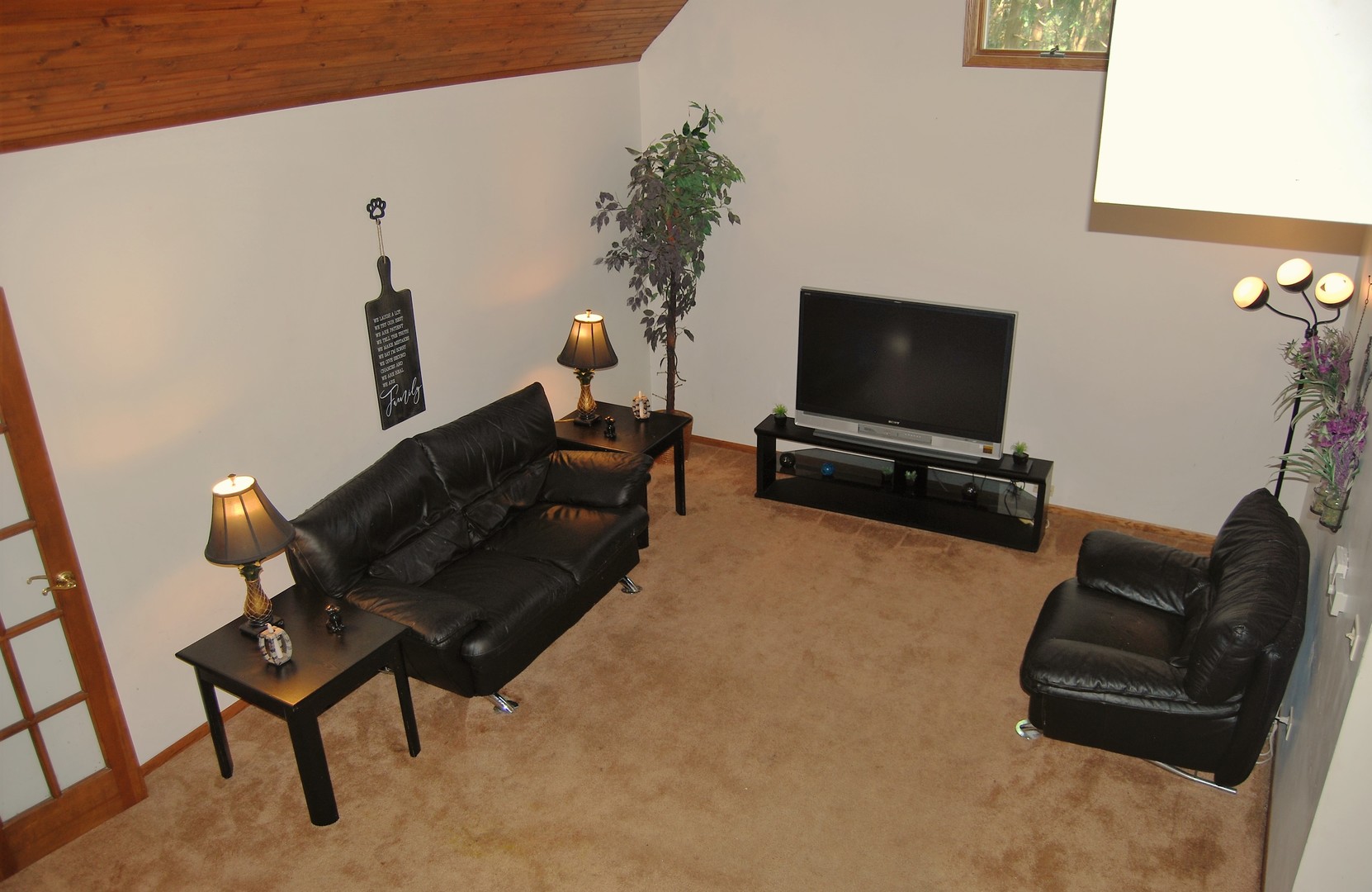 604 Golfview Terrace Buffalo Grove, IL 60089 - Photo 10 of 24 a living room with furniture and a flat screen tv