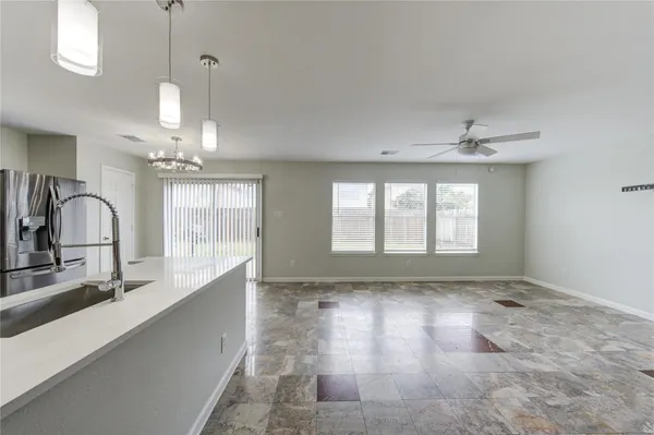 a view of entryway and kitchen