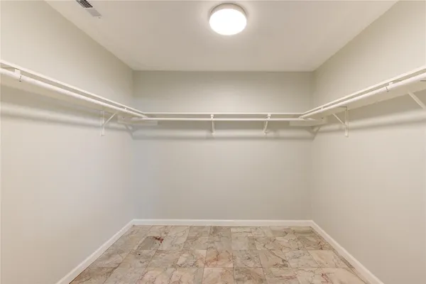 a view of a room with shelf on the wall