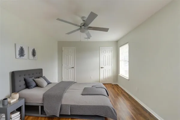 a bedroom with a bed and window