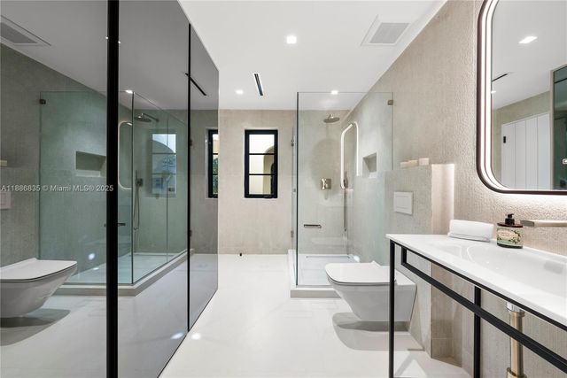 a large white bed in a white room